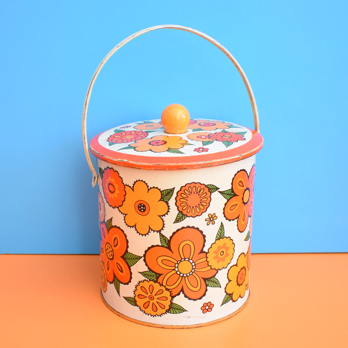 Four Metal selling Flowered Tins; Larger Handled Tin from 1950s, Medium Wang and Bunte Round Tins from 1970s, and Wee Marigold Soap Tin from 1980s